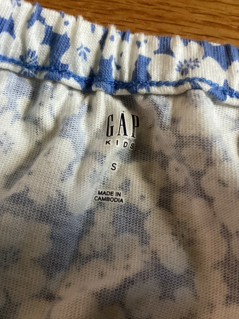 A blue and white floral Gap Kids romper size 6-7